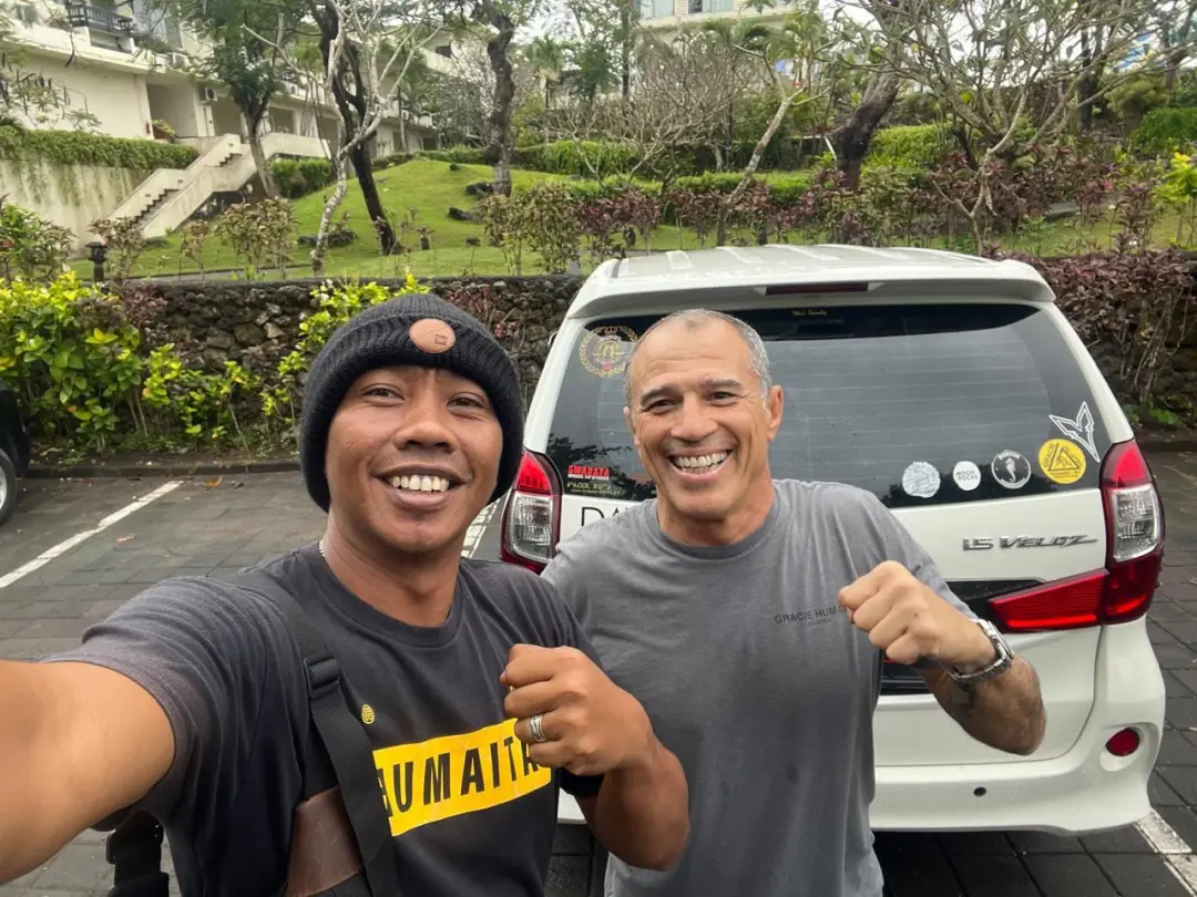Our driver with a guest next to the car